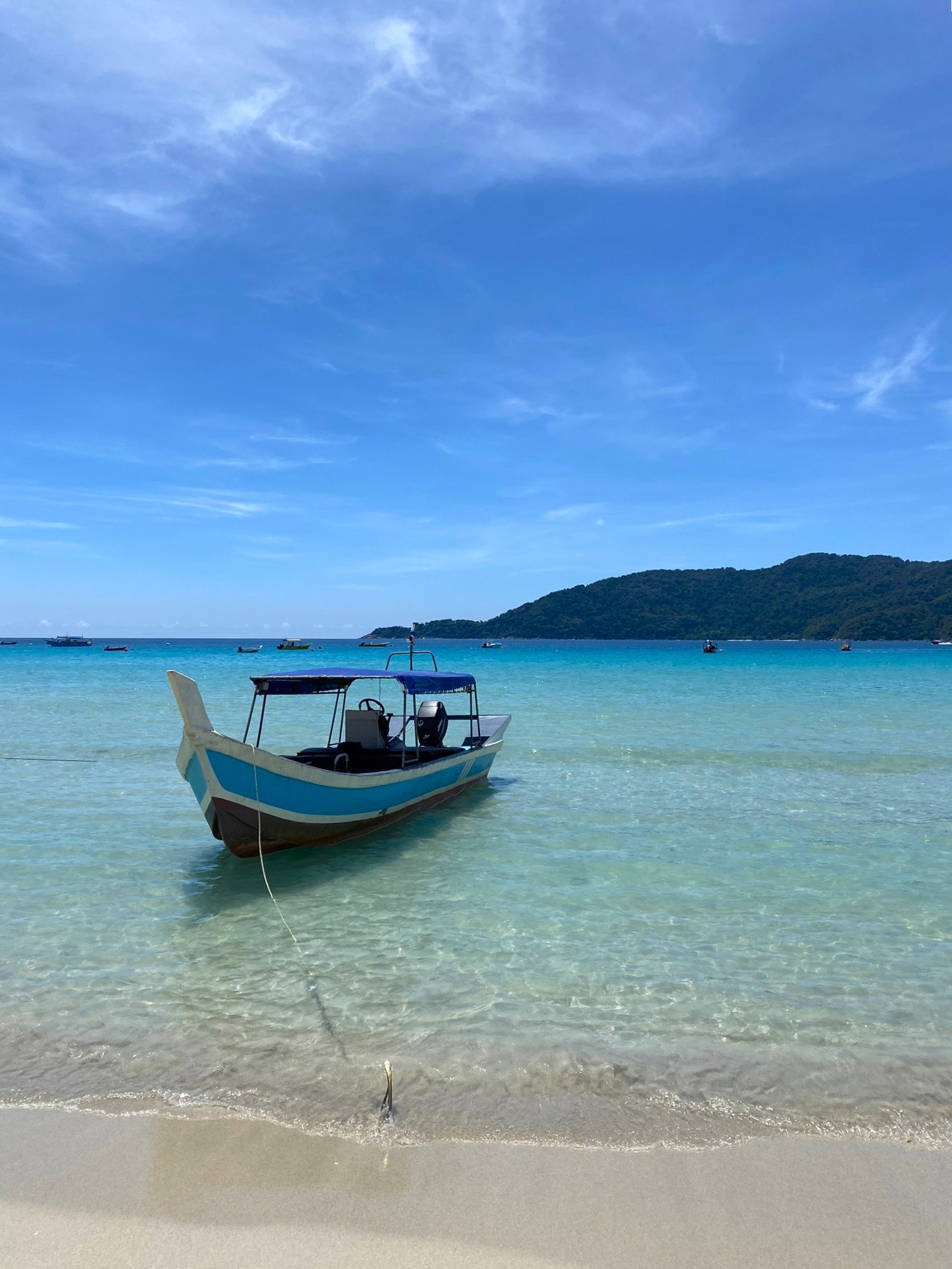 The Perhentian Islands are accessible by boat from Kuala Besut Jetty on the mainland. Speedboat transfers take about 30–45 minutes to reach Perhentian Kecil or Perhentian Besar. To get to Kuala Besut, travelers typically fly to Kota Bharu or Kuala Terengganu and continue by taxi or bus to the jetty. There are no cars on the islands; transport is by boat taxi or on foot, giving the Perhentians their peaceful, car-free atmosphere.
